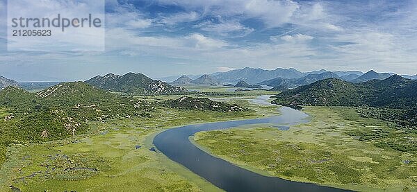 Aerial panorama view of Rijeka Crnojevica  beautiful river between mountains flowing into Skadar Lake  Montenegro  Europe