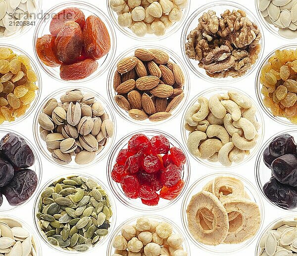 Seamless food background made of nuts  dried berries and dry fruits on white