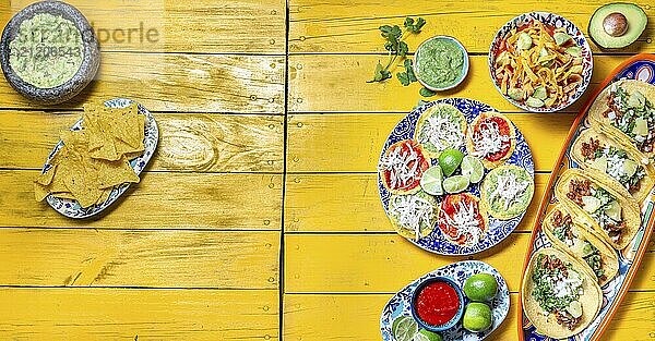 Food  Food  Mexican festive food for independence day  independencia chiles en nogada  tacos al pastor  chalupas pozole  tamales  chicken with mole poblano sauce. Yellow background