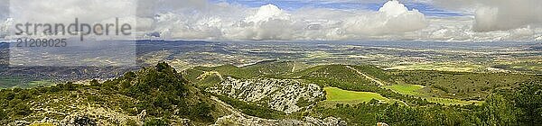 Springtime aerial landscape at La Silleta de Padul  Sierra Nevada  Andalucia  Spain. Dramatic cloudscape  with rain showers in the distance