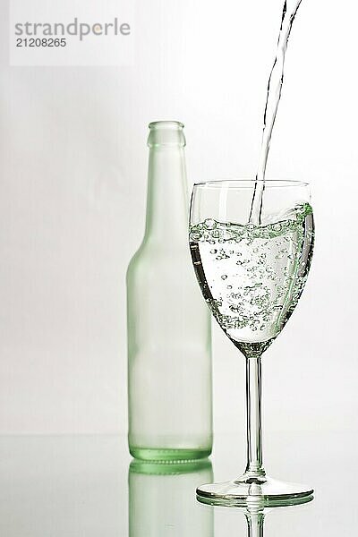 Water glass in front of a white background