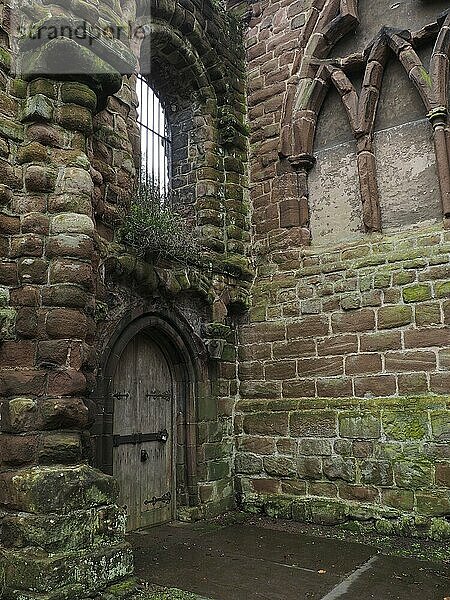 Ruined medieval stone walls of the eastern end of destroyed choir and tower of St Johns church in Chester