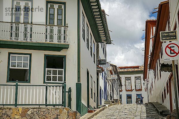 View to a cobblestone street framed by pretty colonial houses in Diamantina  Minas Gerais  Brazil  South America