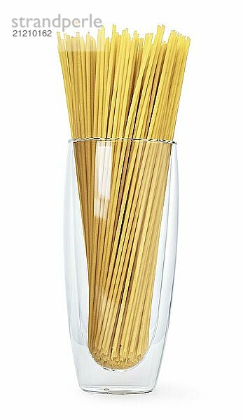 Raw spaghetti in a transparent vase isolated on white