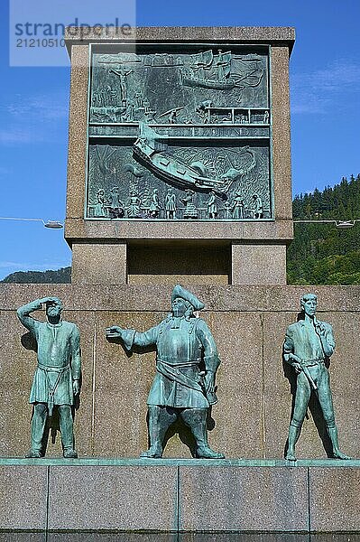 Sjomannsmonumentet south side monument to seafarers shows three historical figures  with a detailed relief in the background under a blue sky  Bergen  Vestland  Norway  Europe