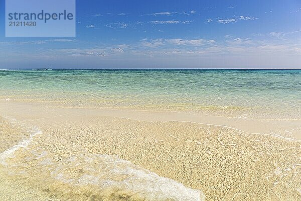 Beautiful landscape with white sandy sea spit beach and warm tropical ocean