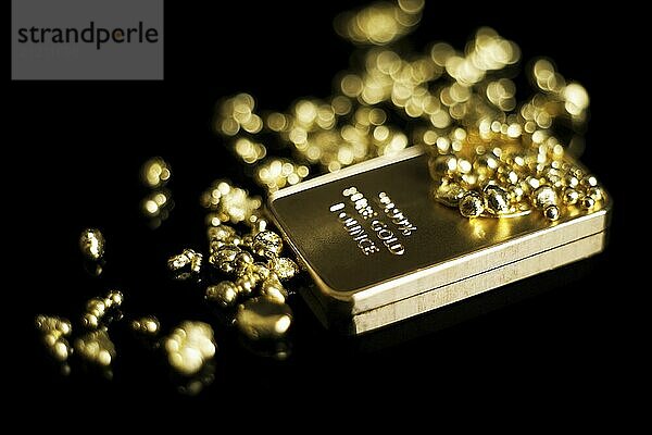 Gold bar 999 precious metal  black background