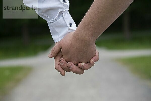 2 people holding hands