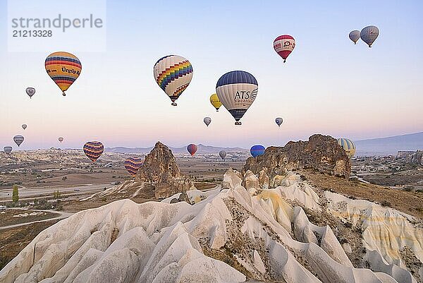 Flying hot air balloons and rock landscape at sunrise time in Goreme  Cappadocia  Turkey  Asia