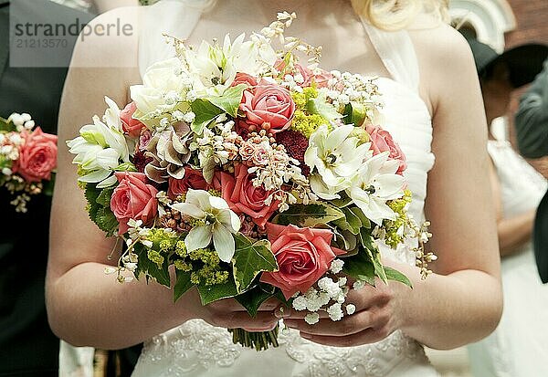 Bride holding bunch of flowers at a wedding