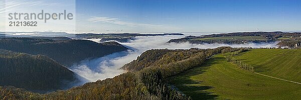 Thick fog fills the valleys in autumn