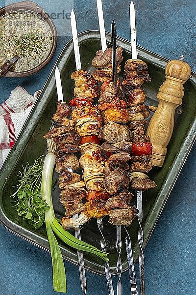 Food Photography  Bbq grilled meat pork  chicken and vegetable skewers on tray. Top view  flat lay. Blue background