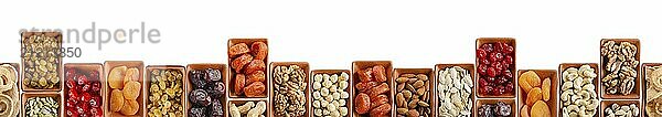 Horizontally Seamless flat lay food frame of dehydrated fruits  seeds and nuts on white. Non-perishable antioxidant gluten free foods concept