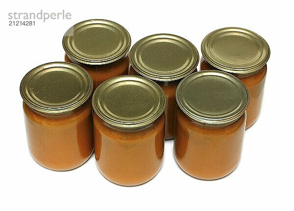 Vegetable paste in glass jars on white background