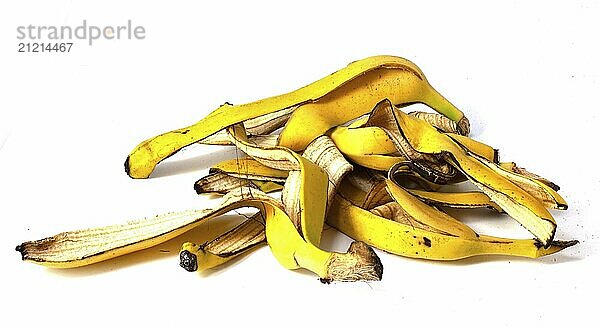 A pile of banana peels  organic fruit waste on a white background