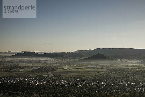 Veils of mist drift through the landscape at the foot of the Swabian Alb