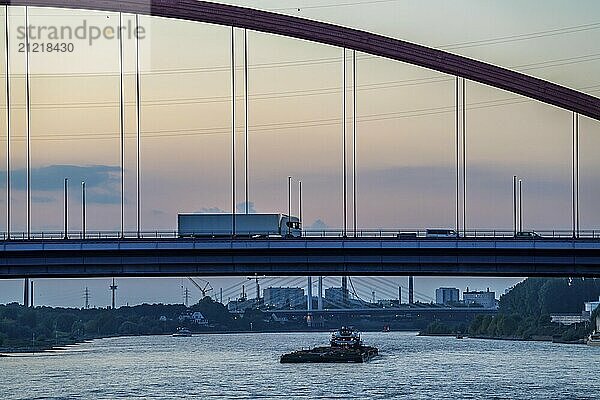 The Bridge of Solidarity  the longest tied-arch bridge in Germany  over the Rhine from Duisburg-Hochfeld to DU-Rheinhausen  the road bridge is dilapidated and has to be rebuilt  many thousands of lorries from the Logport port and cars use the bridge every day  new construction by 2040  cargo ships  Duisburg  North Rhine-Westphalia  Germany  Europe