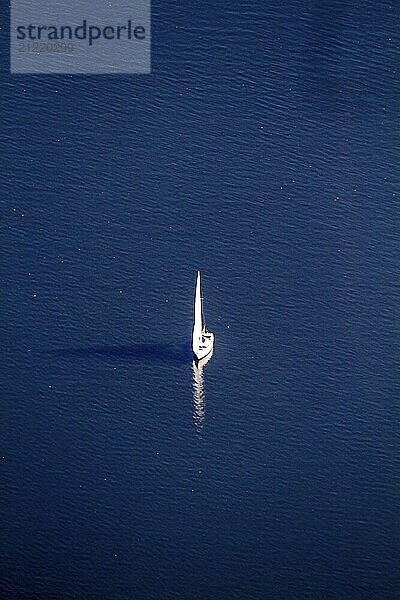 Sailing boat on the abldeney lake in Essen. Aerial View  Sailing boat on the abldeney lake. North Rhine-Westphalia  Ruhr area