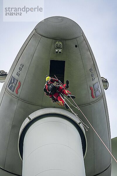 Height rescuers from the Gelsenkirchen fire brigade practise abseiling from a wind turbine from a height of 110 metres after rescuing an accident victim from the nacelle  Gladbeck  North Rhine-Westphalia  Germany  Europe