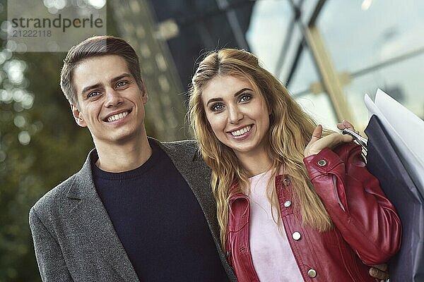 Portrait of a couple with shopping bags in the city.People  sale  love and happiness concept