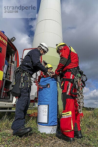 Height rescuers from the Gelsenkirchen fire brigade practise abseiling from a wind turbine from a height of 110 metres after rescuing an accident victim from the nacelle  Gladbeck  North Rhine-Westphalia  Germany  Europe