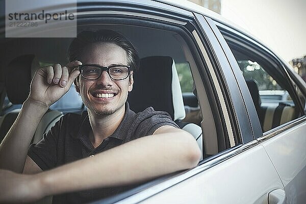 Enjoy the drive. Image of young handsome guy sitting in car