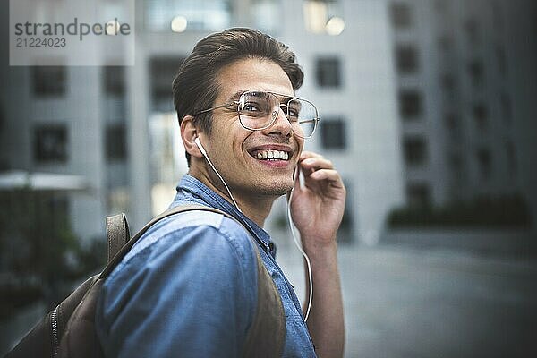 Portrait of handsome successful businessman walking on the street and thinking about startup project