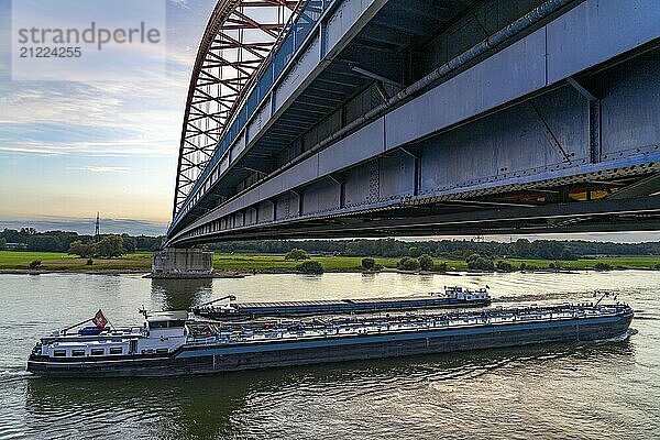 The Bridge of Solidarity  the longest tied-arch bridge in Germany  over the Rhine from Duisburg-Hochfeld to DU-Rheinhausen  the road bridge is dilapidated and has to be rebuilt  many thousands of lorries from the Logport port and cars use the bridge every day  new construction by 2040  cargo ships  Duisburg  North Rhine-Westphalia  Germany  Europe