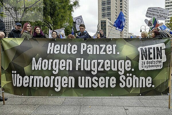 Poster in the layout of the German Armed Forces with the inscription Heute Panzer. Tomorrow aeroplanes. The day after tomorrow our sons / No to German involvement in war at the Die Waffen nieder demonstration on Breitscheidplatz in Berlin. The event is directed against all wars and calls for an immediate stop to all arms deliveries. Berlin  03.10.2024