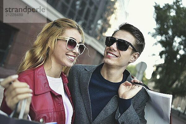 Portrait of a couple with shopping bags in the city.People  sale  love and happiness concept