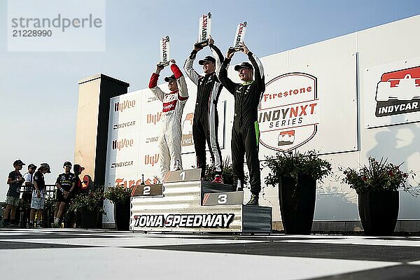 RASMUS LINDH (76) (R) of Gothenburg  Sweden and their team celebrate a third place finish in the IndyNXT race during the HyVee Indycar Weekend at Iowa Speedway in Newtown IA