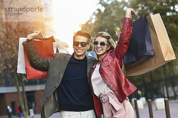 Portrait of a couple with shopping bags in the city.People  sale  love and happiness concept