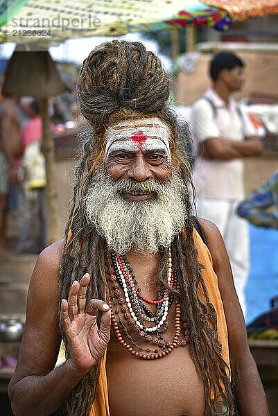 Portrait of a sadhu on ghat by Ganges river  Varanasi  India  Asia