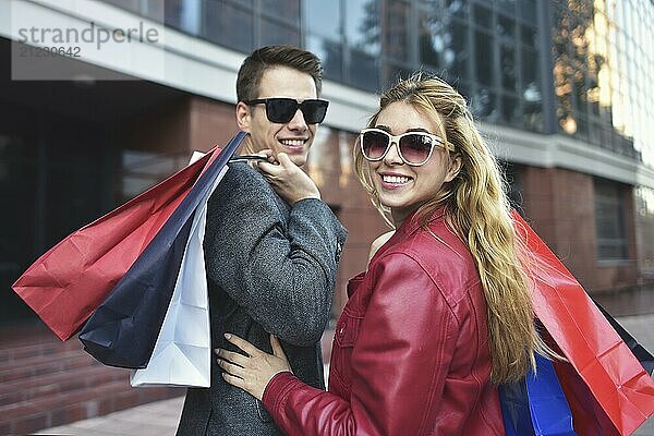 Portrait of a couple with shopping bags in the city.People  sale  love and happiness concept