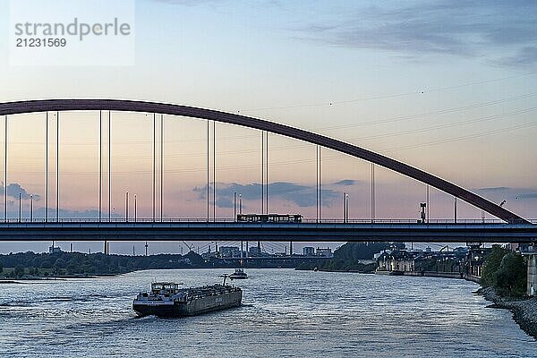 The Bridge of Solidarity  the longest tied-arch bridge in Germany  over the Rhine from Duisburg-Hochfeld to DU-Rheinhausen  the road bridge is dilapidated and has to be rebuilt  many thousands of lorries from the Logport port and cars use the bridge every day  new construction by 2040  cargo ships  Duisburg  North Rhine-Westphalia  Germany  Europe