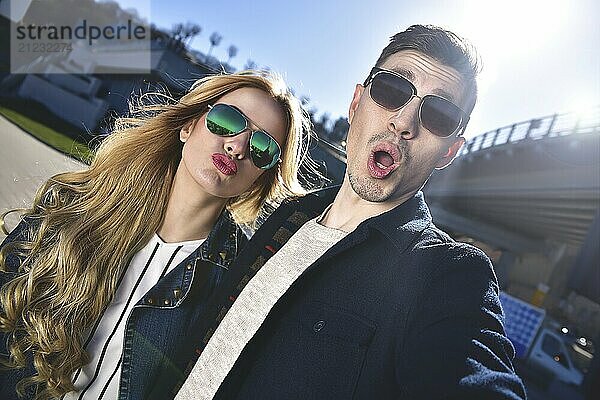 Happy young couple in love takes a selfie portrait