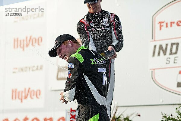 RASMUS LINDH (76) (R) of Gothenburg  Sweden celebrates on the podium after finishing 3rd during the HyVee Indycar Weekend at Iowa Speedway in Newtown IA