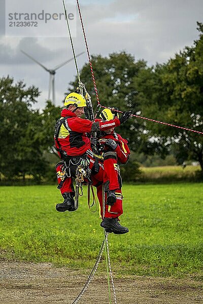 Height rescuers from the Gelsenkirchen fire brigade practise abseiling from a wind turbine from a height of 110 metres after rescuing an accident victim from the nacelle  Gladbeck  North Rhine-Westphalia  Germany  Europe