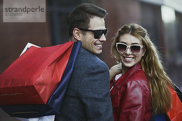 Picture showing young couple shopping in the city. Portrait of a couple with shopping bags in the city.People  sale  love and happiness concept