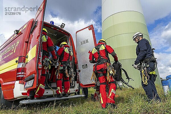 Height rescuers from the Gelsenkirchen fire brigade practise abseiling from a wind turbine from a height of 110 metres after rescuing an accident victim from the nacelle  Gladbeck  North Rhine-Westphalia  Germany  Europe