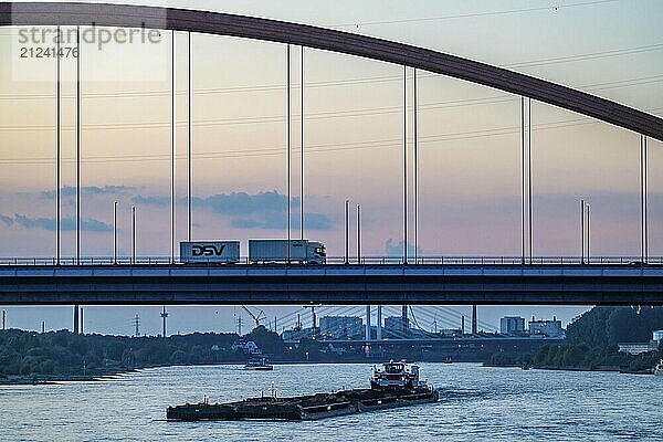 The Bridge of Solidarity  the longest tied-arch bridge in Germany  over the Rhine from Duisburg-Hochfeld to DU-Rheinhausen  the road bridge is dilapidated and has to be rebuilt  many thousands of lorries from the Logport port and cars use the bridge every day  new construction by 2040  cargo ships  Duisburg  North Rhine-Westphalia  Germany  Europe