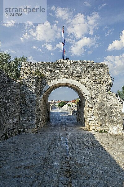 Skyline of a small Mediterranean town  historic city centre with massive city walls on an island in a bay or lagoon. Morning atmosphere in Nin  Zadar  Dalmatia  Croatia  Adriatic Sea  Europe