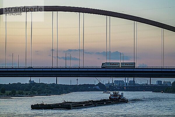 The Bridge of Solidarity  the longest tied-arch bridge in Germany  over the Rhine from Duisburg-Hochfeld to DU-Rheinhausen  the road bridge is dilapidated and has to be rebuilt  many thousands of lorries from the Logport port and cars use the bridge every day  new construction by 2040  cargo ships  Duisburg  North Rhine-Westphalia  Germany  Europe