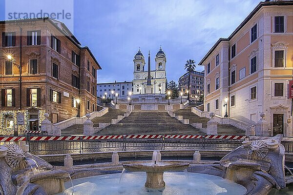 View over a beautiful historic Roman city. At one of the sights  with old buildings and urban flair. Morning sunrise at the Spanish Steps Scalinata di Trinità dei Monti  Rome  Italy  Europe