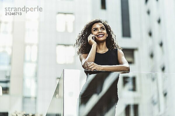 Happy smiling afroamerican woman have a nice conversation at street