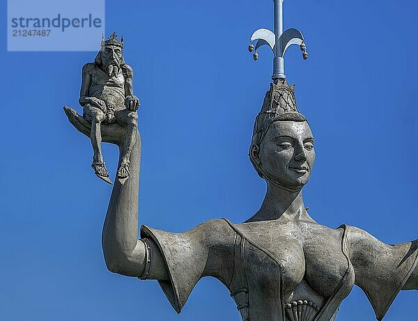 Royal figure on the right hand of Imperia  a rotating  nine-metre-high concrete statue in the port of Constance  designed by Peter Link. The statue is a satirical reminder of the Council of Constance (1414-1418)  Constance  Baden-Württemberg  Germany  Europe