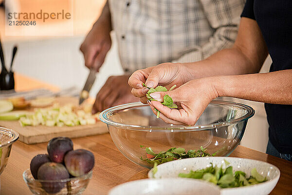 Close up of hands preparing a healthy meal