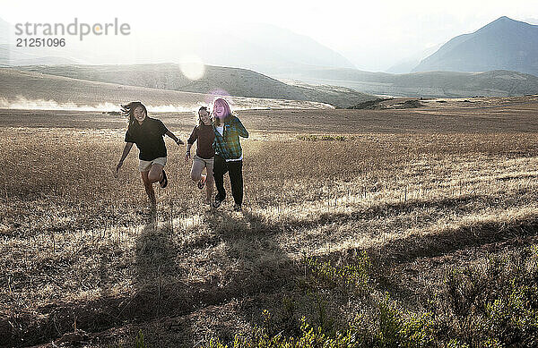 three girls running in peru