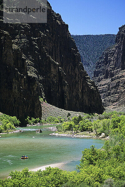 Rafters float the Gates of Ladore section of the Green River in Dinosaur National Monument  Colorado.