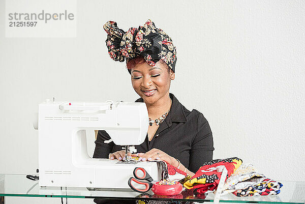 Woman smiling while using the sowing machine